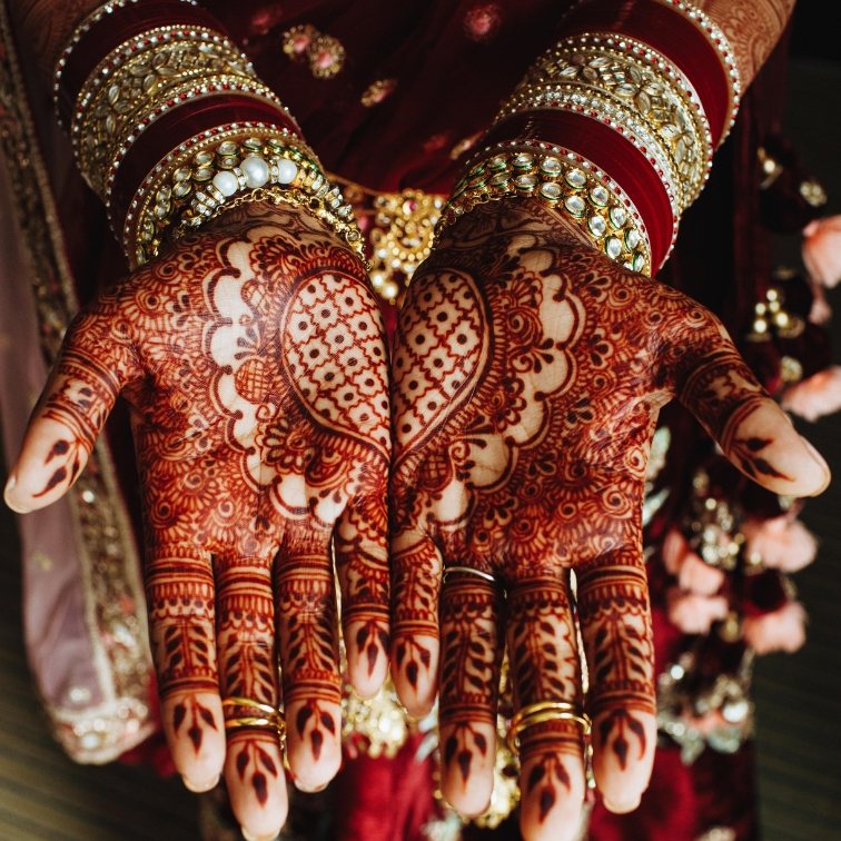 Elaborate bridal mehendi covering both open palms